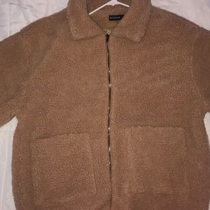 Oversized sheep skin bomer jacket.